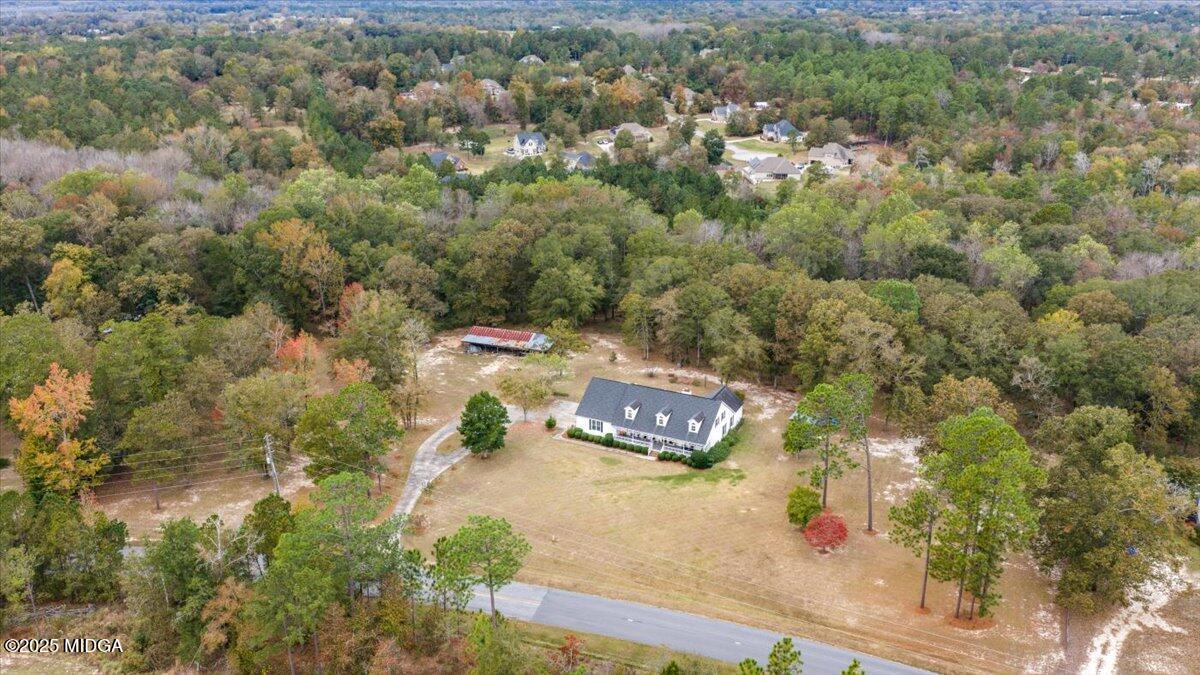 5771 Rogers Road Lizella, GA 31052 - Photo 67 of 74 an aerial view of residential houses with outdoor space