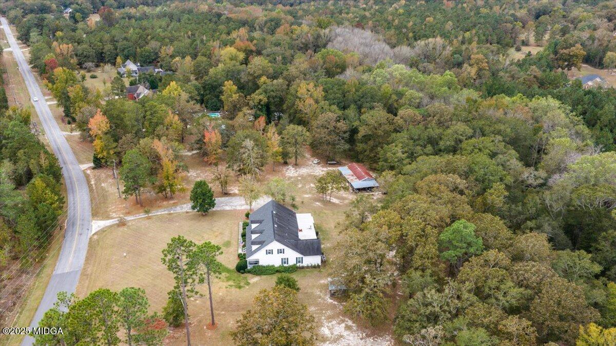 5771 Rogers Road Lizella, GA 31052 - Photo 68 of 74 a view of a house with a yard and a forest