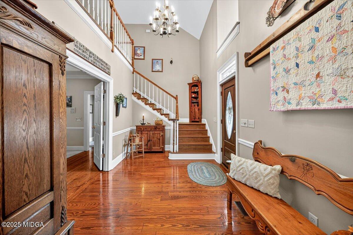 5771 Rogers Road Lizella, GA 31052 - Photo 7 of 74 a view of entryway livingroom and hall with wooden floor