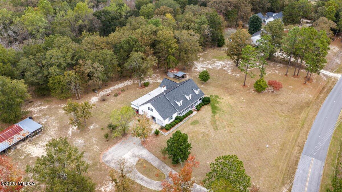 5771 Rogers Road Lizella, GA 31052 - Photo 74 of 74 an aerial view of a house with a yard and lake view