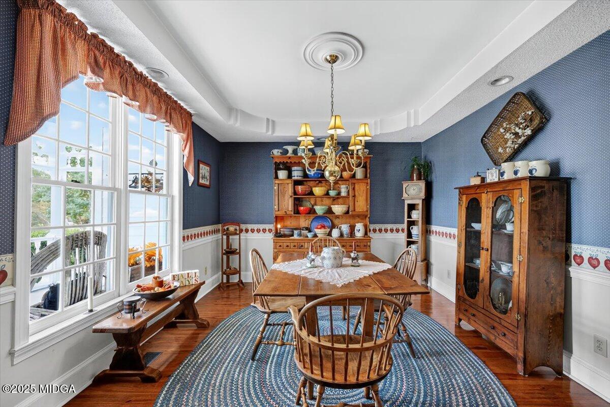 5771 Rogers Road Lizella, GA 31052 - Photo 9 of 74 a view of a dining room with furniture window and wooden floor