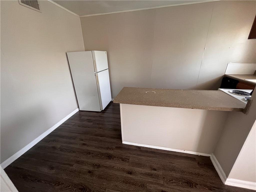 3304 Red River Street, Unit 204 Austin, TX 78705 - Photo 4 of 17 a view of an empty room with wooden floor