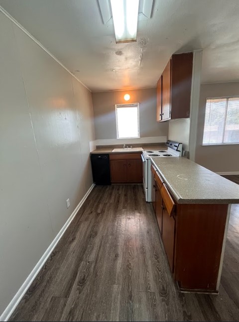 3304 Red River Street, Unit 204 Austin, TX 78705 - Photo 6 of 17 a kitchen with a sink and wooden floor