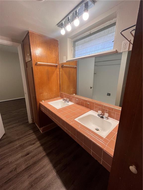 3304 Red River Street, Unit 204 Austin, TX 78705 - Photo 9 of 17 a bathroom with a sink and a mirror