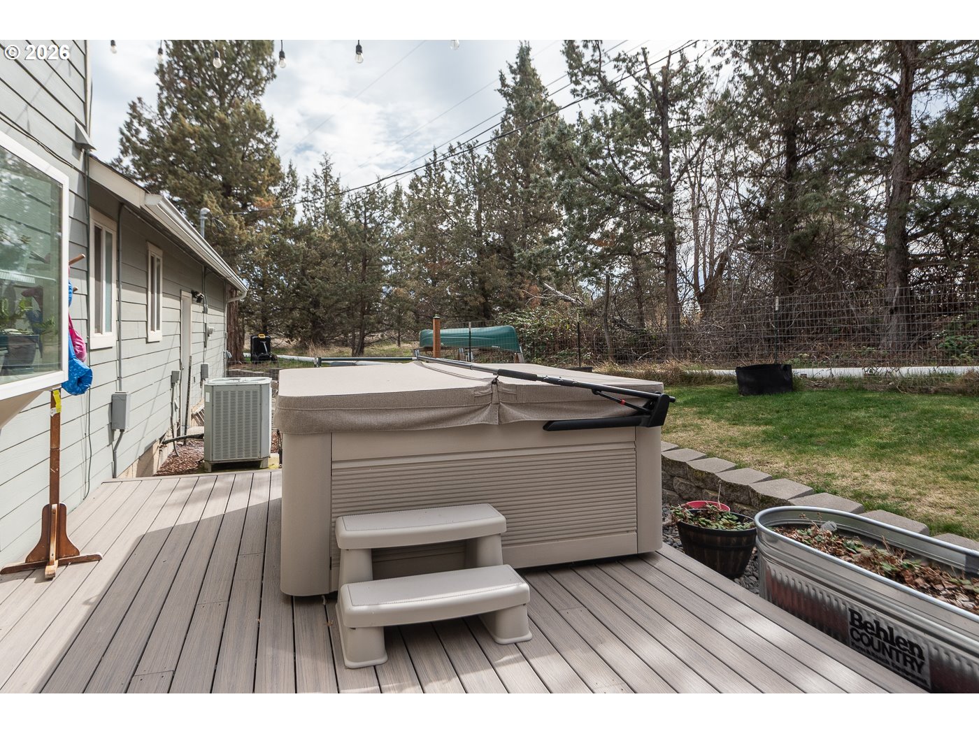 905 Southwest Burns Lane Madras, OR 97741 - Photo 11 of 40 a view of a backyard with sitting area