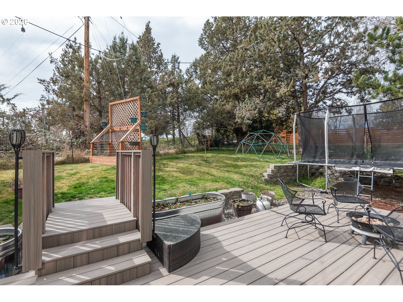 905 Southwest Burns Lane Madras, OR 97741 - Photo 15 of 40 a view of a park with wooden floor and fence