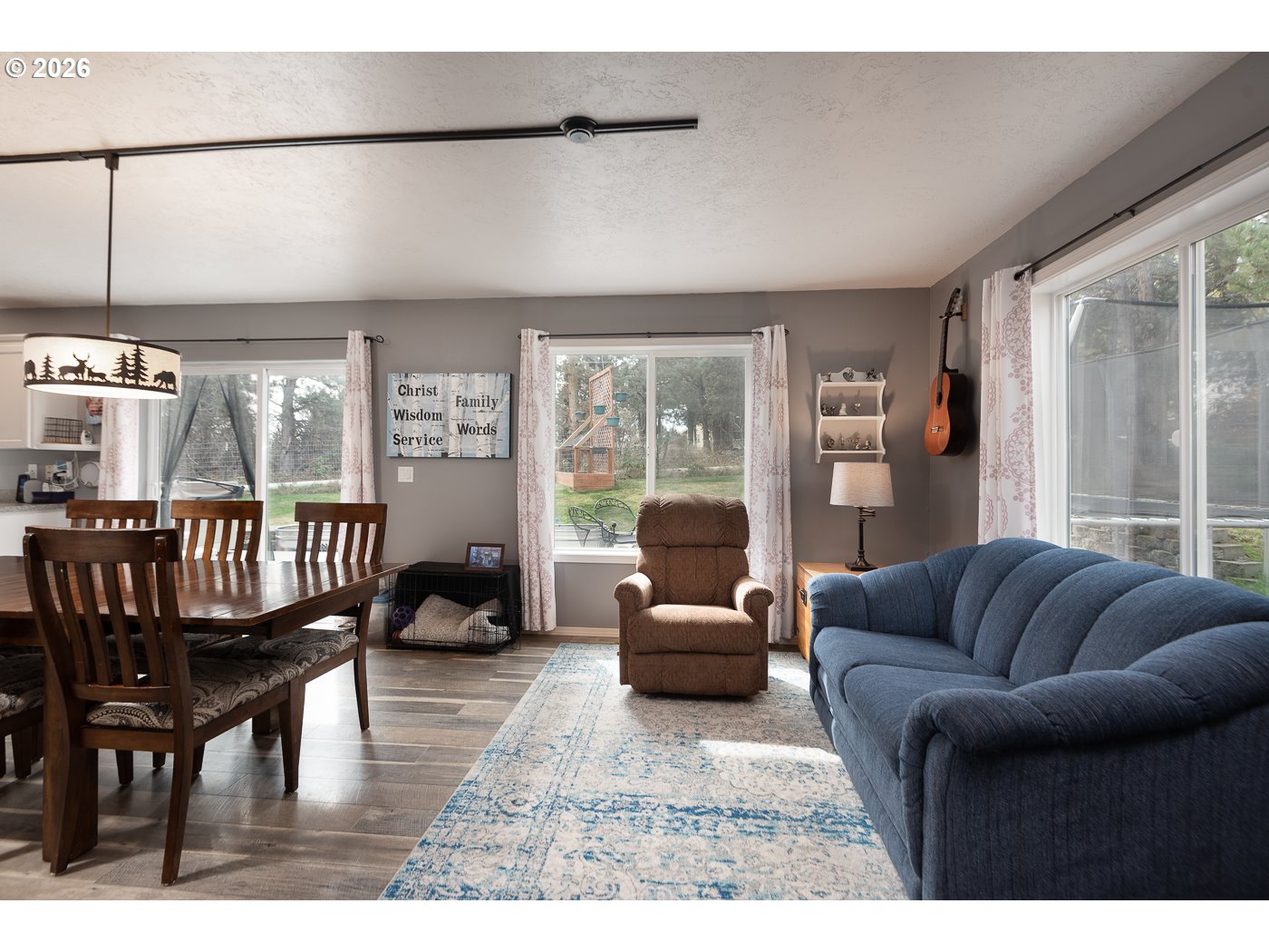 905 Southwest Burns Lane Madras, OR 97741 - Photo 17 of 40 a living room with furniture and a large window
