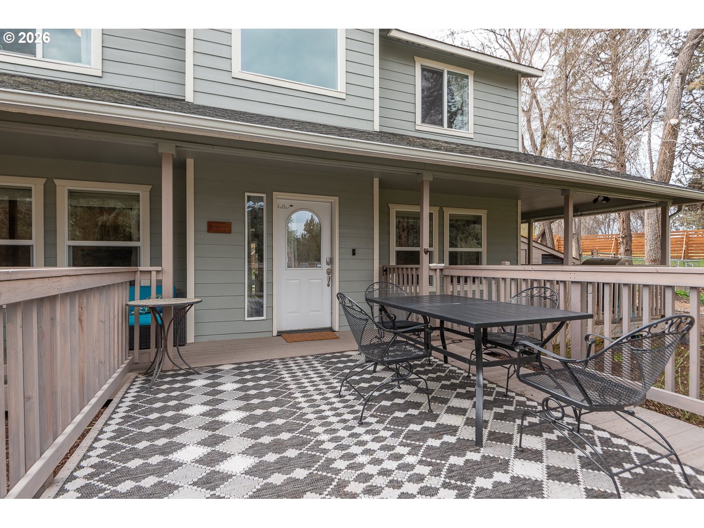905 Southwest Burns Lane Madras, OR 97741 - Photo 2 of 40 a backyard of a house with barbeque oven table and chairs