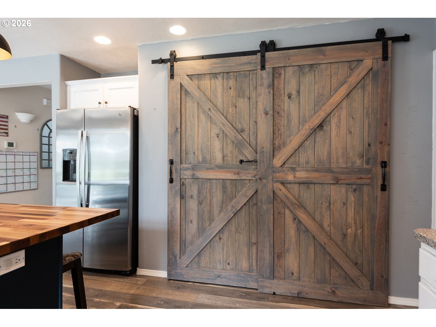 905 Southwest Burns Lane Madras, OR 97741 - Photo 22 of 40 a view of kitchen with cabinets and wooden floor