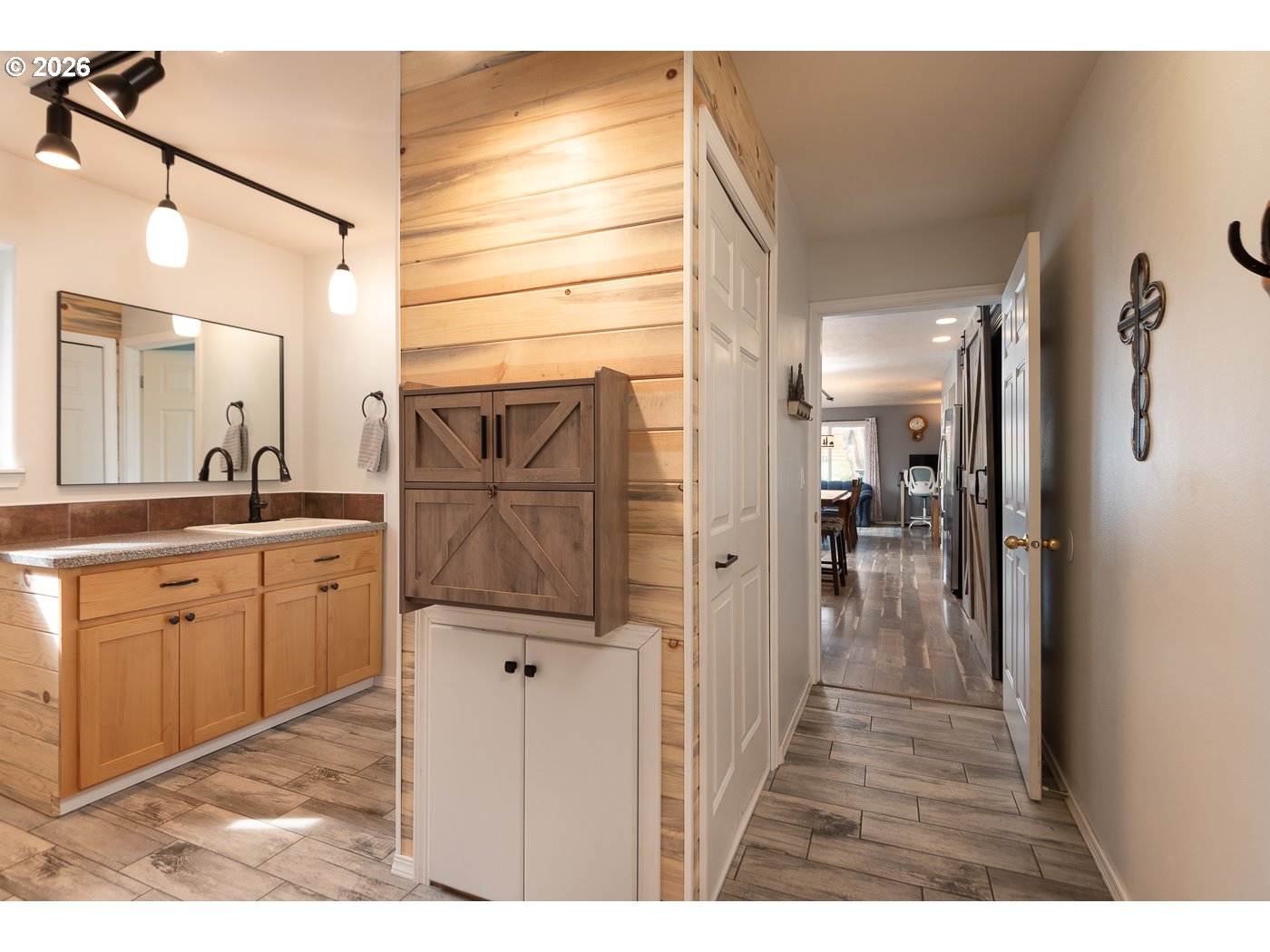 905 Southwest Burns Lane Madras, OR 97741 - Photo 26 of 40 a bathroom with a glass door shower a sink and a mirror