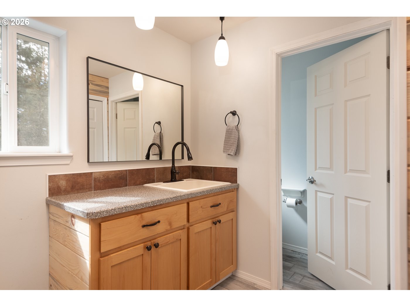 905 Southwest Burns Lane Madras, OR 97741 - Photo 28 of 40 a bathroom with a sink and a mirror