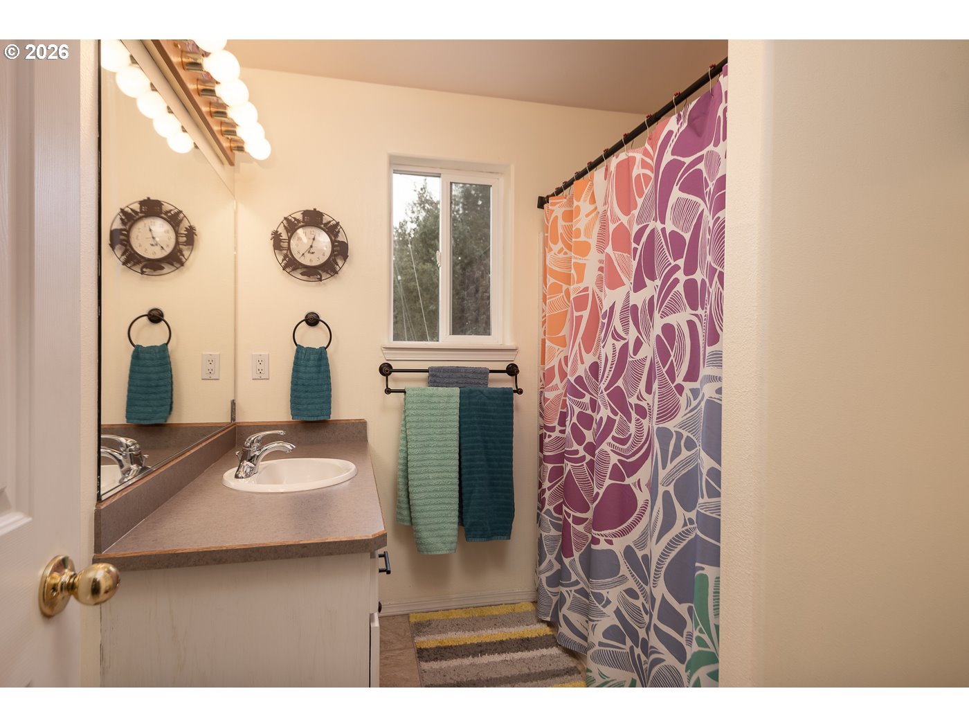905 Southwest Burns Lane Madras, OR 97741 - Photo 33 of 40 a bathroom with a sink and a mirror
