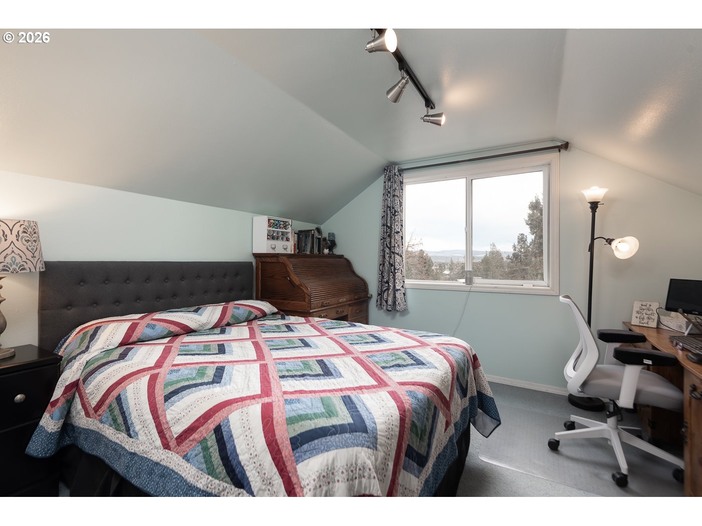 905 Southwest Burns Lane Madras, OR 97741 - Photo 34 of 40 a bedroom with a bed and a window
