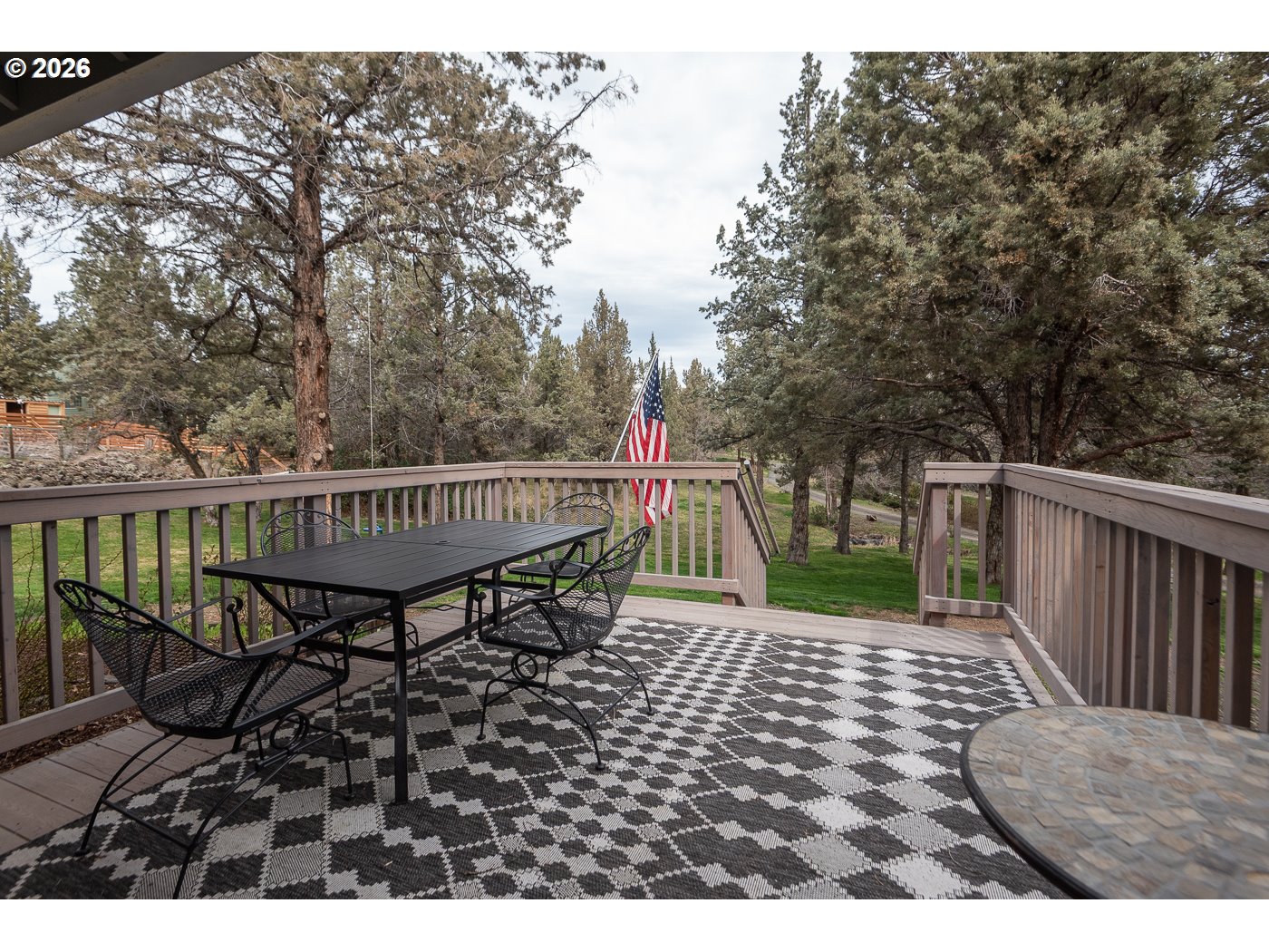 905 Southwest Burns Lane Madras, OR 97741 - Photo 4 of 40 a view of a roof deck with wooden floor and fence