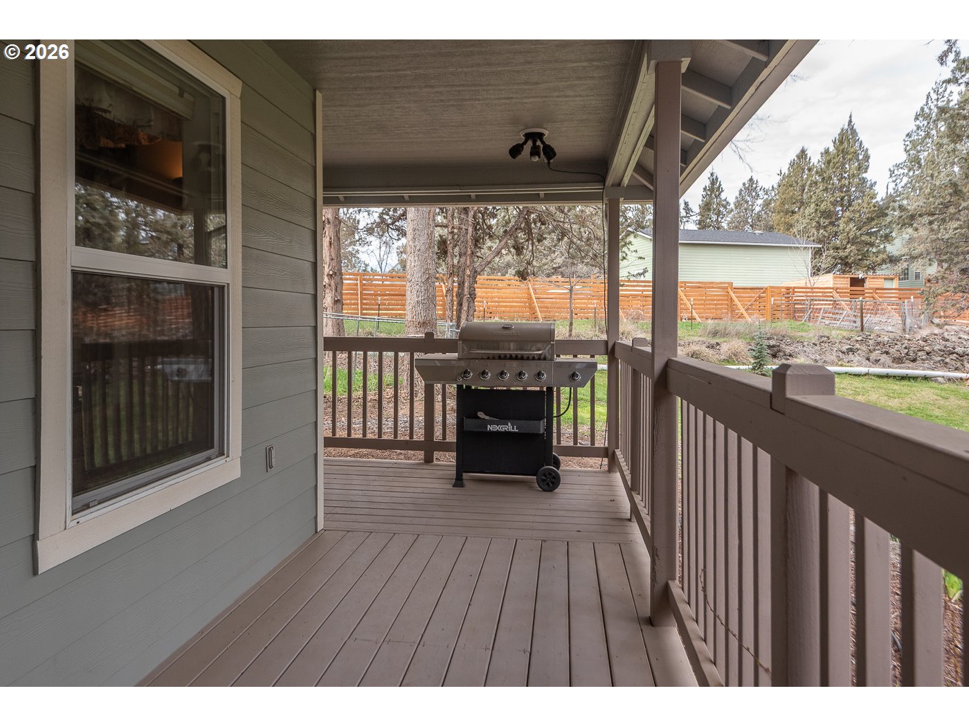 905 Southwest Burns Lane Madras, OR 97741 - Photo 5 of 40 a view of a porch with wooden floor and outdoor space