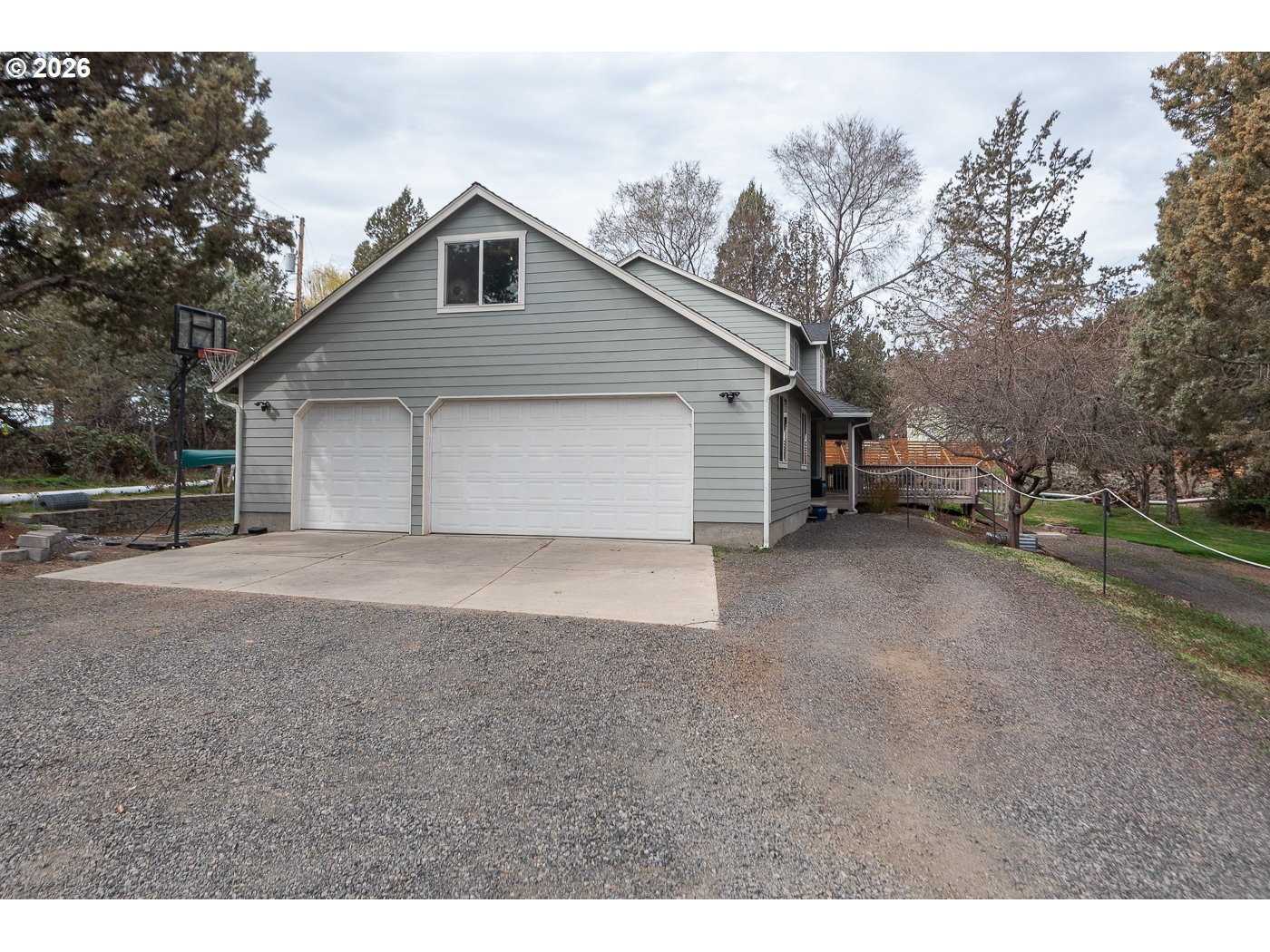 905 Southwest Burns Lane Madras, OR 97741 - Photo 7 of 40 a front view of a house with a yard and garage