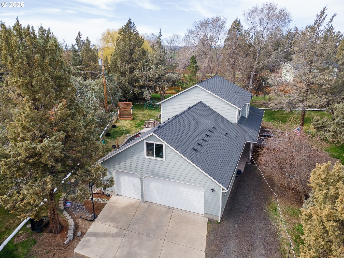 905 Southwest Burns Lane Madras, OR 97741 - Photo 8 of 40 a view of a house with a yard and tree s