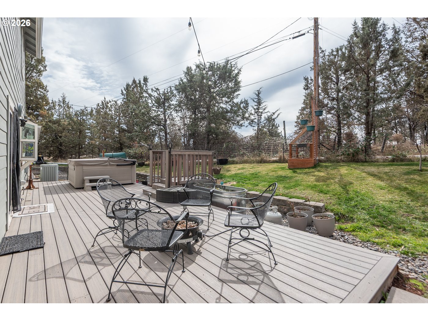 905 Southwest Burns Lane Madras, OR 97741 - Photo 10 of 40 a view of backyard with seating space and trees