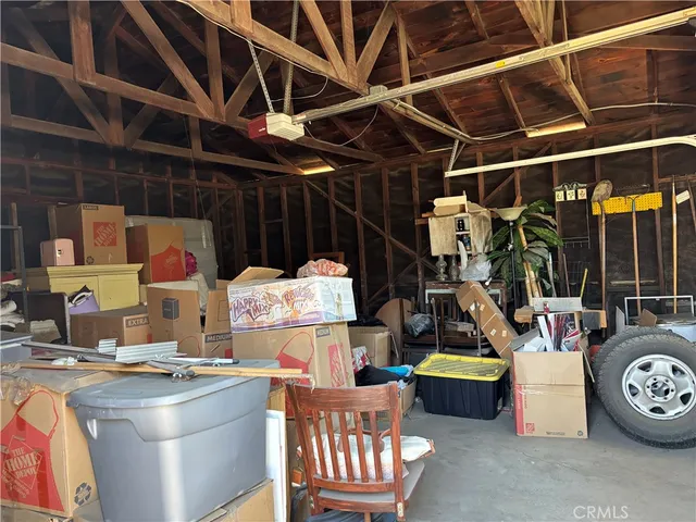 a view of kitchen with table and chairs