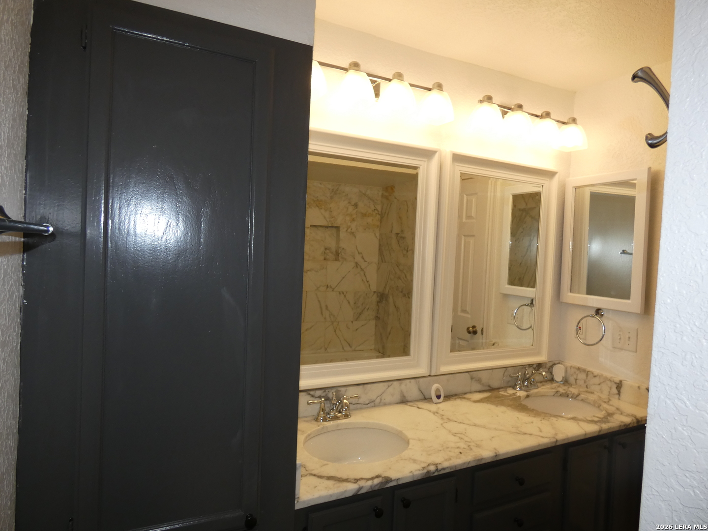 14745 Babcock Road, Unit 610 San Antonio, TX 78249 - Photo 14 of 32 a bathroom with a sink and a mirror