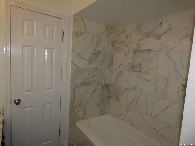 a bathroom with a bathtub