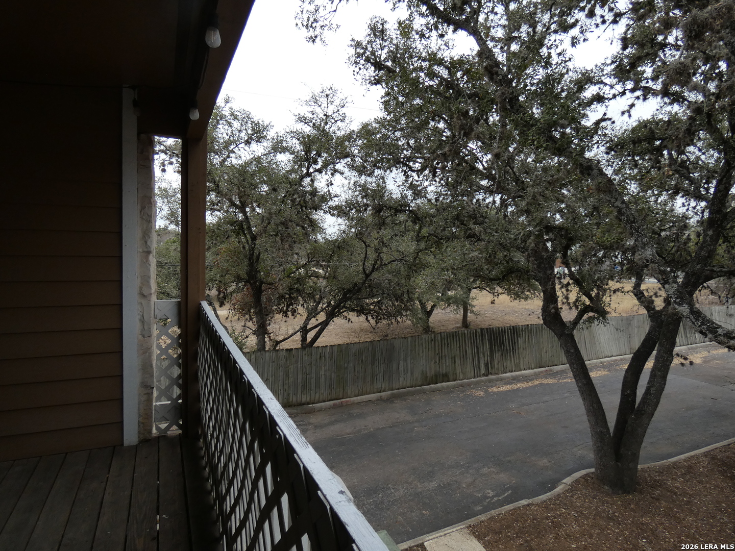 14745 Babcock Road, Unit 610 San Antonio, TX 78249 - Photo 25 of 32 a view of balcony and wooden