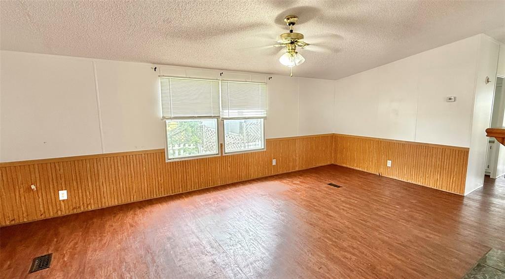 3789 Jacobs Lane Kaufman, TX 75142 - Photo 6 of 33 wooden floor in an empty room with a window