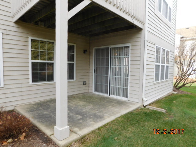 2803 Rutland Circle, Unit 104 Naperville, IL 60564 - Photo 3 of 24 a view of a house with a yard
