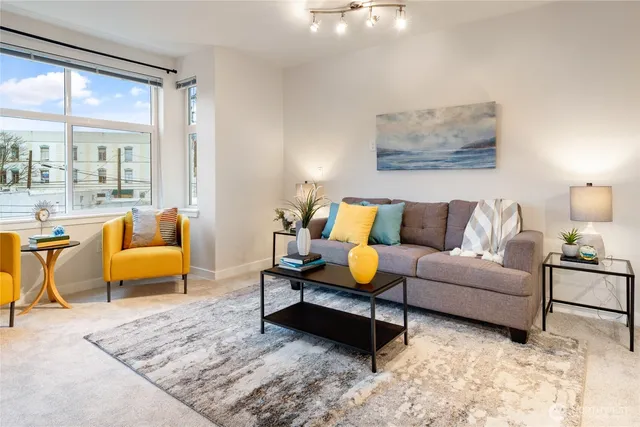 a living room with furniture and a rug