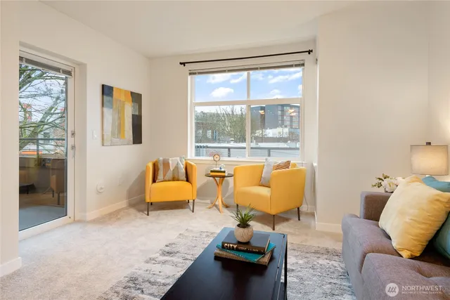 a living room with furniture and a large window