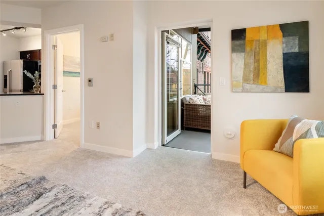 a view of livingroom with furniture and refrigerator