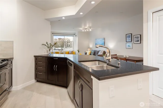 a kitchen with a sink and a stove