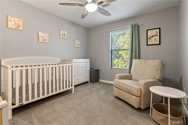 a bedroom with furniture and windows