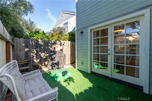 a view of house with backyard space and garden