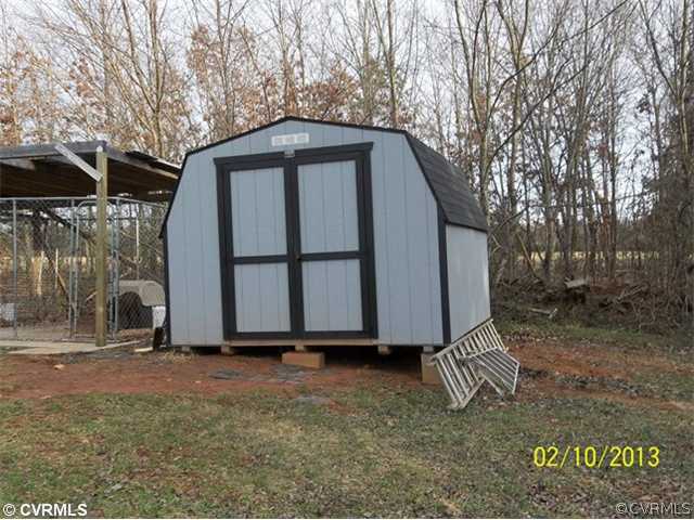 808 Olive Branch Road Prospect, VA 23960 - Photo 7 of 7 a backyard of a house with barbeque oven