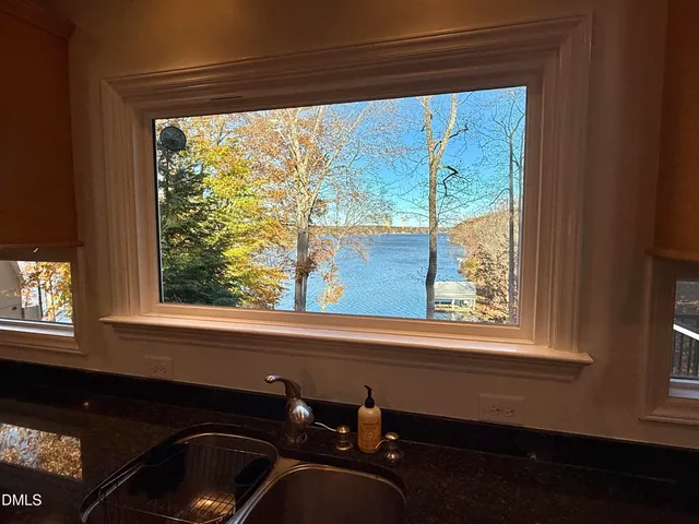 a view of living room with furniture and window