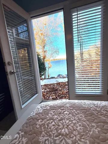 a bedroom with a bed and a lamp