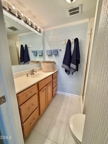 a bathroom with a sink a vanity and a mirror