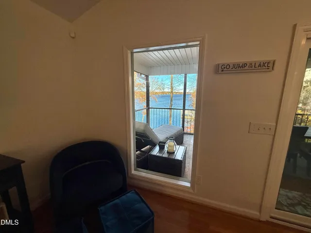 a view of bedroom with furniture and wooden floor