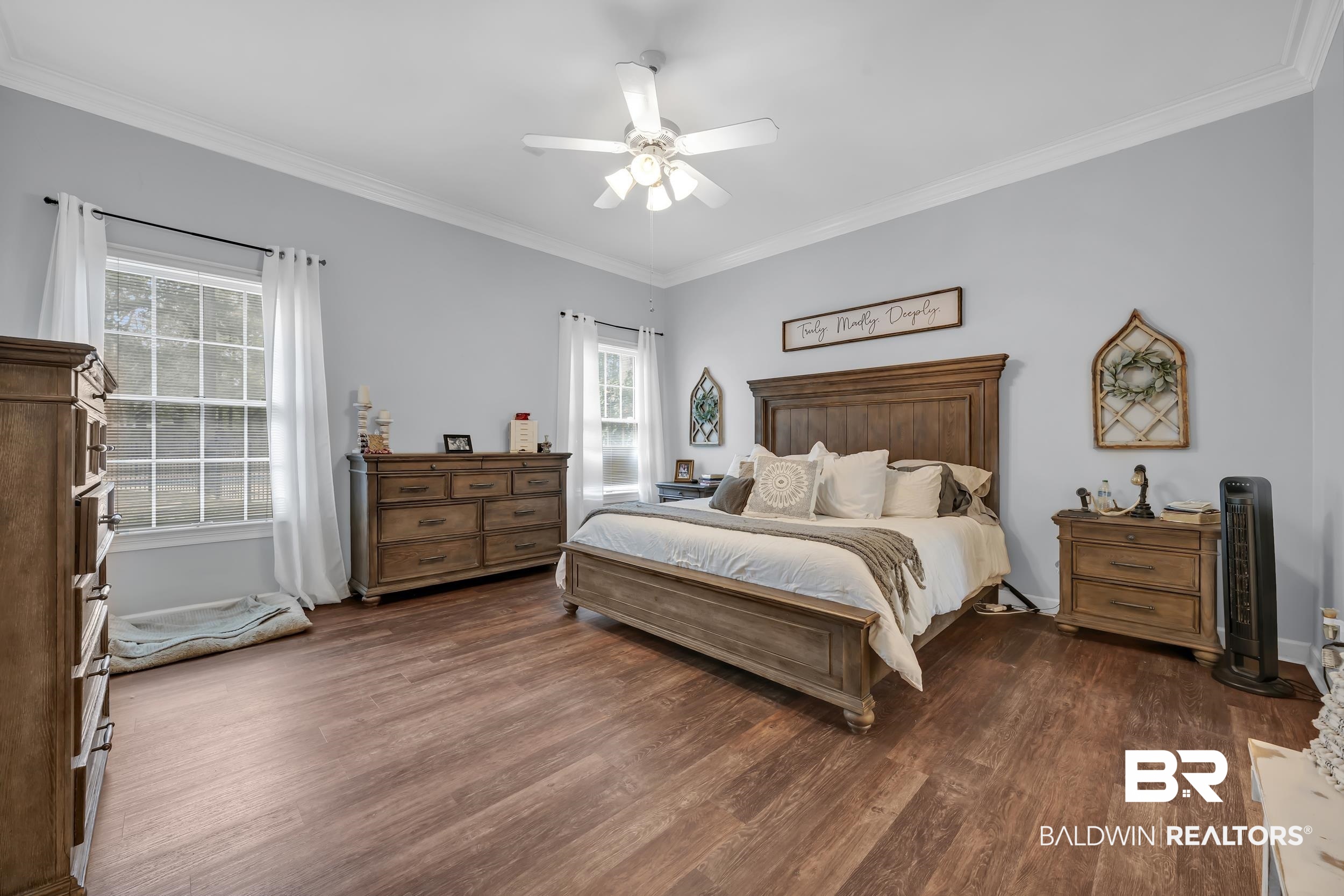 2858 Postoak Circle Mobile, AL 36693 - Photo 19 of 32 Bedroom with dark wood-style flooring, crown molding, and ceiling fan