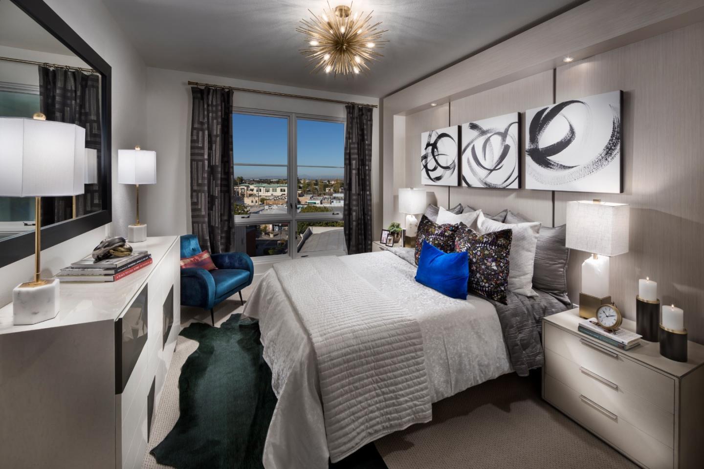 657 Walnut Street, Unit 437 San Carlos, CA 94070 - Photo 2 of 6 a bedroom with a bed and dresser with mirror