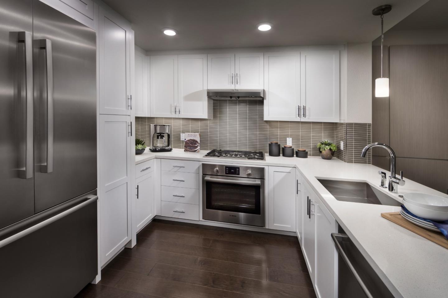 657 Walnut Street, Unit 437 San Carlos, CA 94070 - Photo 5 of 6 a kitchen with granite countertop a sink stainless steel appliances and cabinets