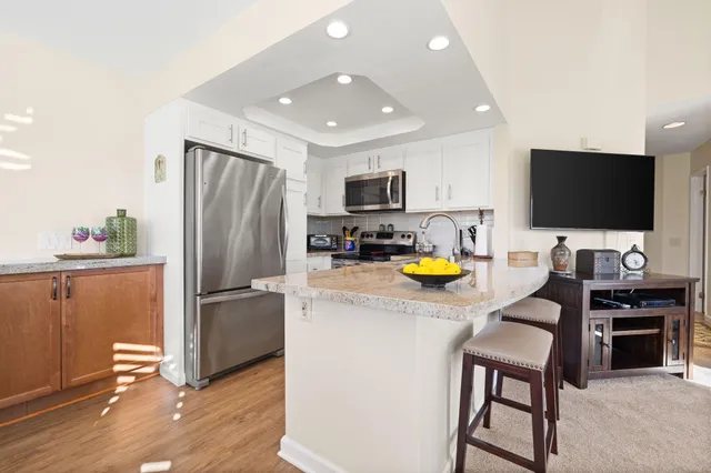 a front view of a house with a large window