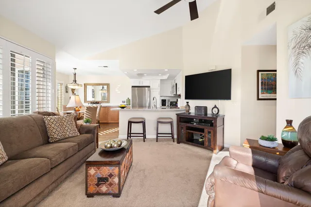 a kitchen with a sink and a large window