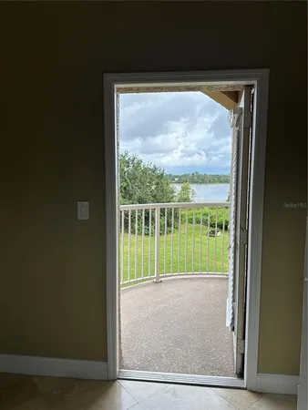 a view of balcony with yard