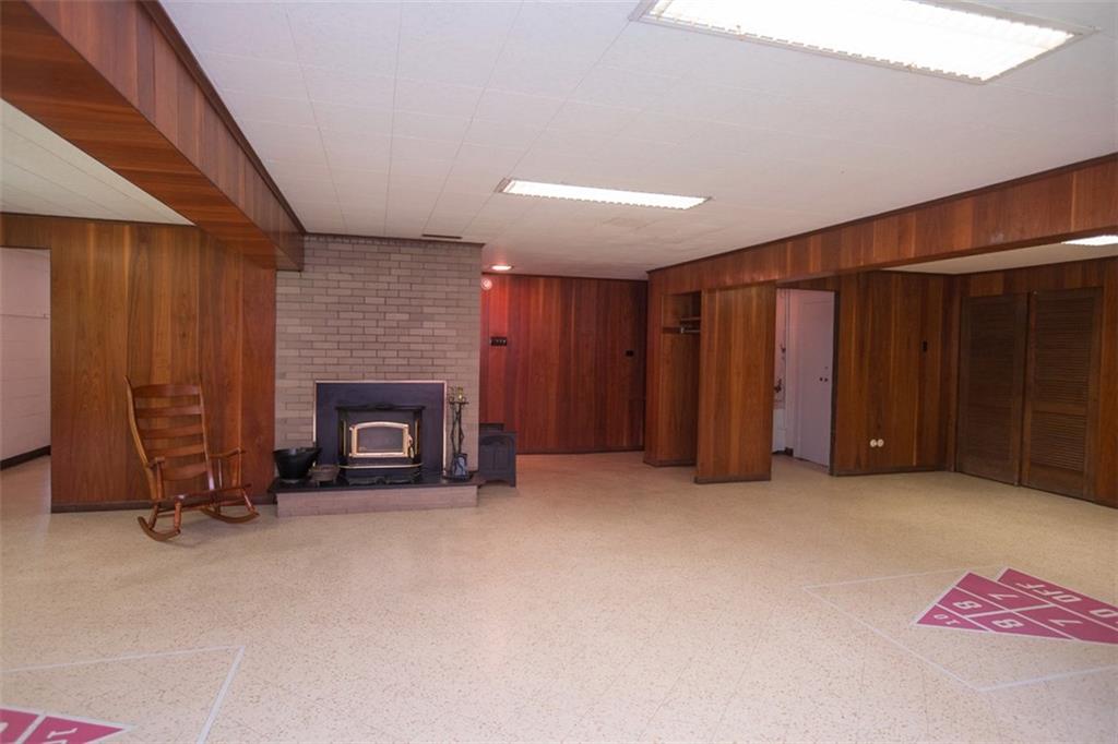 732 Scrubgrass Road Mt. Lebanon, PA 15243 - Photo 18 of 25 The game room offers TONS of closet and storage space with a log burning fireplace!