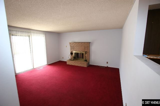 2897 Jake Street Reno, NV 89502 - Photo 3 of 5 a view of empty room with window and fireplace