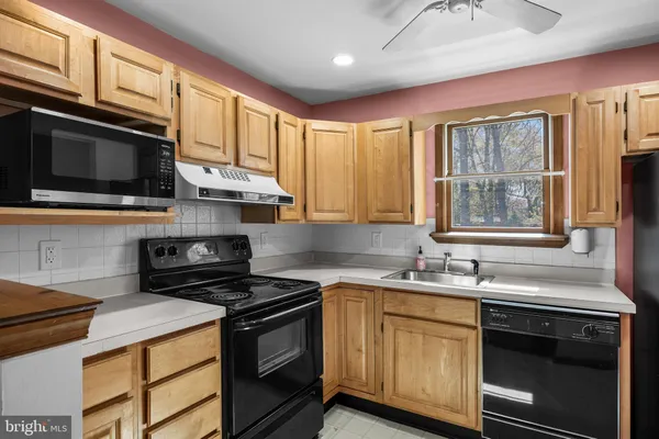 a kitchen with a stove and a microwave