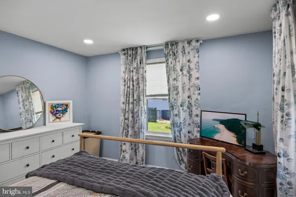 a reading room with furniture and a window
