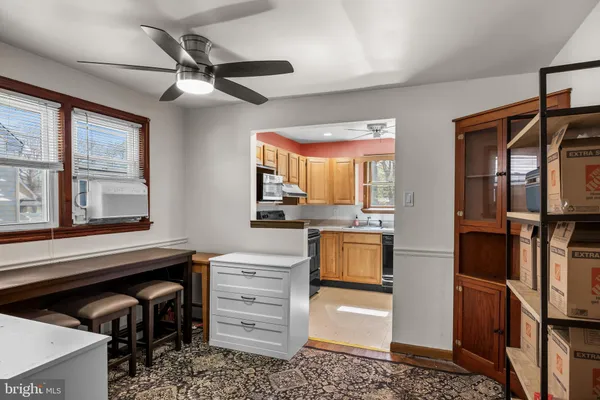 a kitchen with a refrigerator and a stove